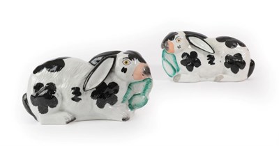 Lot 56 - A Pair of Staffordshire Pottery Rabbits, circa 1870, each recumbent with black spotted markings...