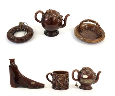 Lot 57 - A Treacle Glaze Cadogan Teapot, circa 1840, of traditional form, indistinct impressed mark,...