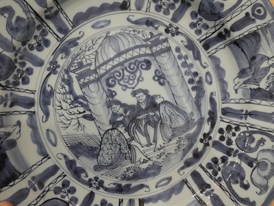 Lot 73 - A Dutch Delft Dish, late 17th century, painted in blue in Kraak style with central European figures