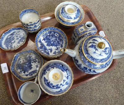 Lot 90 - A Chinese Porcelain Composite Tea Service, Qianlong, of fluted form, painted in underglaze blue...