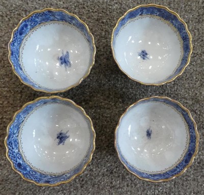 Lot 90 - A Chinese Porcelain Composite Tea Service, Qianlong, of fluted form, painted in underglaze blue...