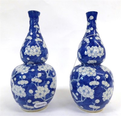 Lot 93 - A Pair of Chinese Porcelain Double Gourd Vases, late 19th century, painted in underglaze blue...