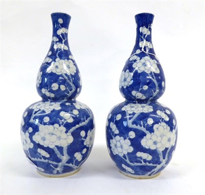 Lot 93 - A Pair of Chinese Porcelain Double Gourd Vases, late 19th century, painted in underglaze blue...