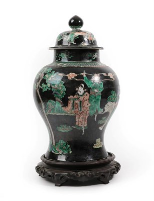 Lot 104 - A Chinese Porcelain Baluster Jar and Cover, 19th century, painted in famille noire enamels with...