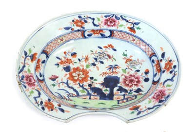 Lot 105 - A Chinese Imari Porcelain Barber's Bowl, 18th century, of ovoid form, painted with flowers and...