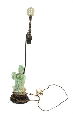 Lot 115 - A Chinese Jade Type Figure of Guanyin, late 19th/20th century, standing holding a flower, 22cm...