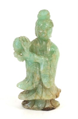Lot 115 - A Chinese Jade Type Figure of Guanyin, late 19th/20th century, standing holding a flower, 22cm...