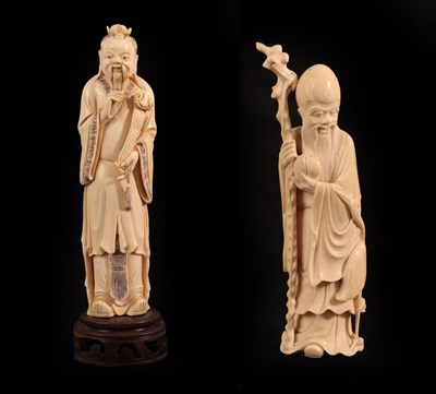 Lot 122 - A Chinese Ivory Figure of a Sage, 19th century, standing wearing flowing robes holding a ruyi...
