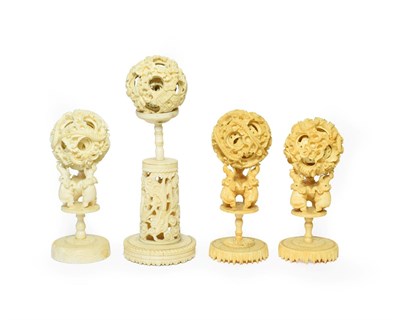 Lot 124 - A Cantonese Ivory Puzzle Ball, 19th century, on a carved and pierced column stand, 19cm high...