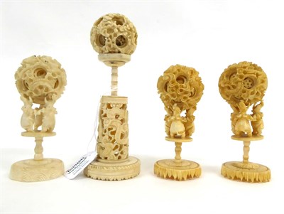 Lot 124 - A Cantonese Ivory Puzzle Ball, 19th century, on a carved and pierced column stand, 19cm high...