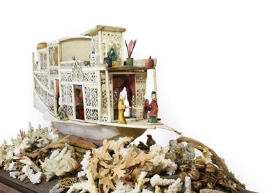 Lot 125 - A Cantonese Ivory Model of a Junk, 19th century, with carved and pierced decoration and with...
