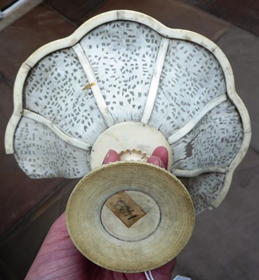 Lot 126 - A Cantonese Ivory Tazza, mid 19th century, of octafoil form on a puzzle ball stem and circular foot