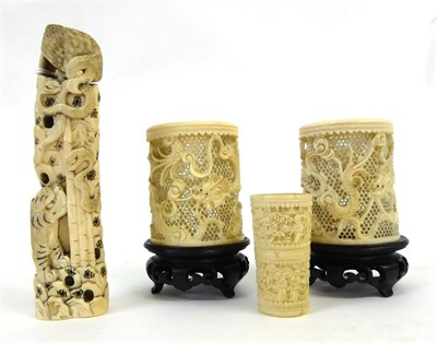 Lot 130 - A Pair of Cantonese Ivory Sleeve Vases, late 19th century, carved and pierced with dragons...