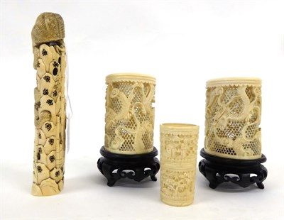 Lot 130 - A Pair of Cantonese Ivory Sleeve Vases, late 19th century, carved and pierced with dragons...
