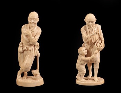 Lot 132 - A Japanese Ivory Okimono as a Farmer, Meiji period, standing leaning on an implement, a pipe in his