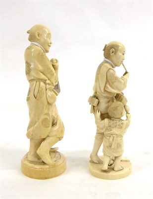 Lot 132 - A Japanese Ivory Okimono as a Farmer, Meiji period, standing leaning on an implement, a pipe in his