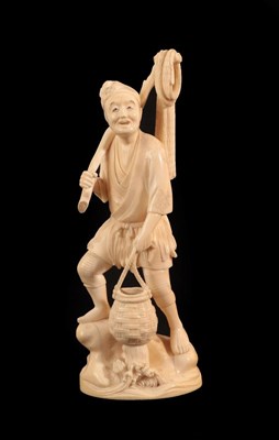 Lot 136 - A Japanese Ivory Okimono as a Fisherman, Meiji period, standing holding a net, a pole and a basket