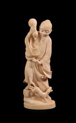 Lot 137 - A Japanese Ivory Okimono of a Sage, Meiji period, standing in flowing robes holding a gourd, a...