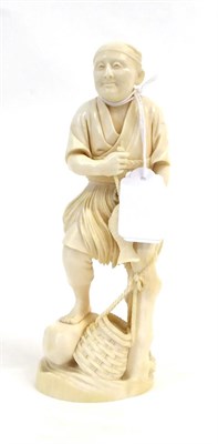 Lot 140 - A Japanese Ivory Okimono as a Fisherman, Meiji period, standing holding a fish on a line leaning on