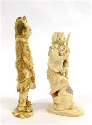 Lot 144 - A Japanese Ivory Okimono as a Woodsman, Meiji period, carrying a staff and two toads, a further...