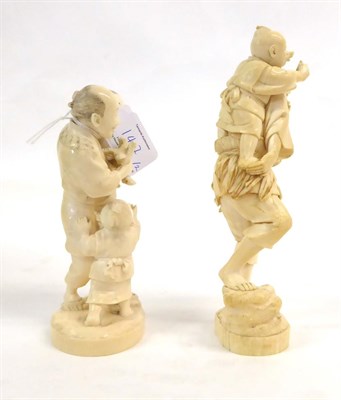 Lot 147 - A Japanese Ivory Okimono as a Father, Meiji period, holding a bird in one hand, a child in the...