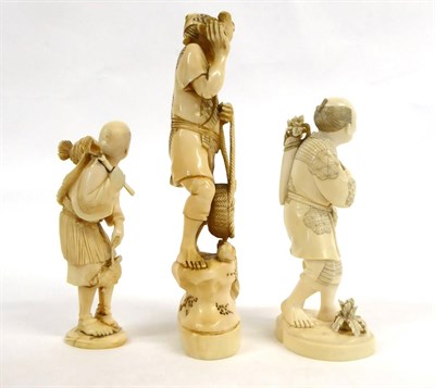 Lot 151 - A Japanese Ivory Okimono as a Farmer, Meiji period, standing holding a bird and a basket of eggs, a