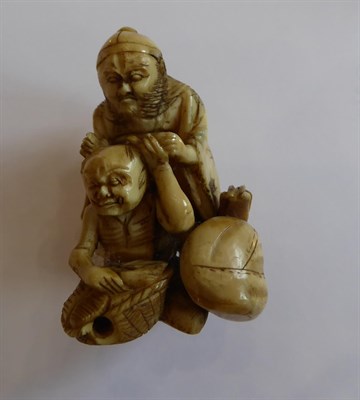 Lot 156 - A Japanese Ivory Netsuke, 19th century, as an Oni carrying a mask and a bag, signed, 3.5cm...