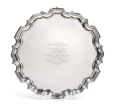 Lot 179 - A George V Silver Salver, by Carrington and Co, London, 1922, shaped circular and on three pad...
