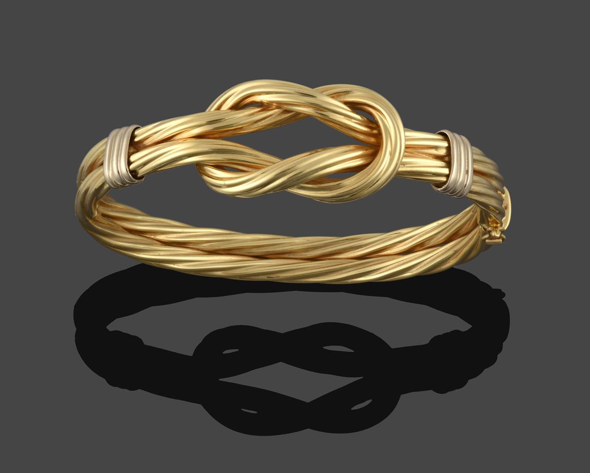 Lot 226 - A Ropetwist Bangle, formed of a double row yellow textured rope with knot detail to the upper...