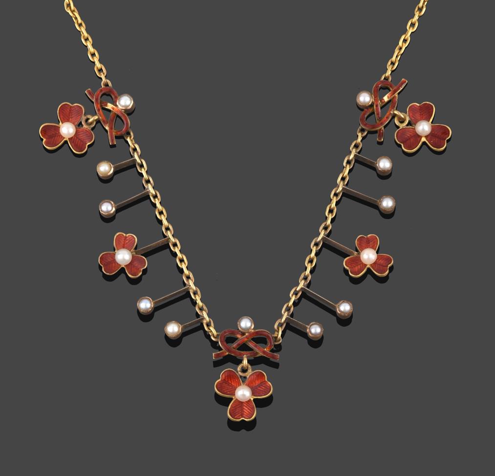 Lot 229 - An Edwardian Enamel and Split Pearl Necklace, circa 1900, three trefoil clover clusters...