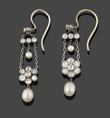 Lot 241 - A Pair of Edwardian Diamond and Pearl Drop Earrings, circa 1900, an old cut diamond suspends...