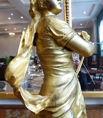 Lot 256 - After Adrien Etienne Gaudez: ''Caecilia'', A Gilt Bronze Figure of a Maiden, standing in...