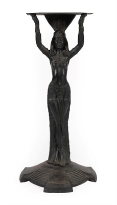 Lot 261 - A Cast Iron Figural Stand, early 20th century, as an Egyptian lady holding a canted rectangular...
