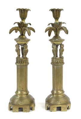 Lot 262 - A Pair of Brass Candlesticks, 19th century, with leaf cast sockets and drip pans on three owl...
