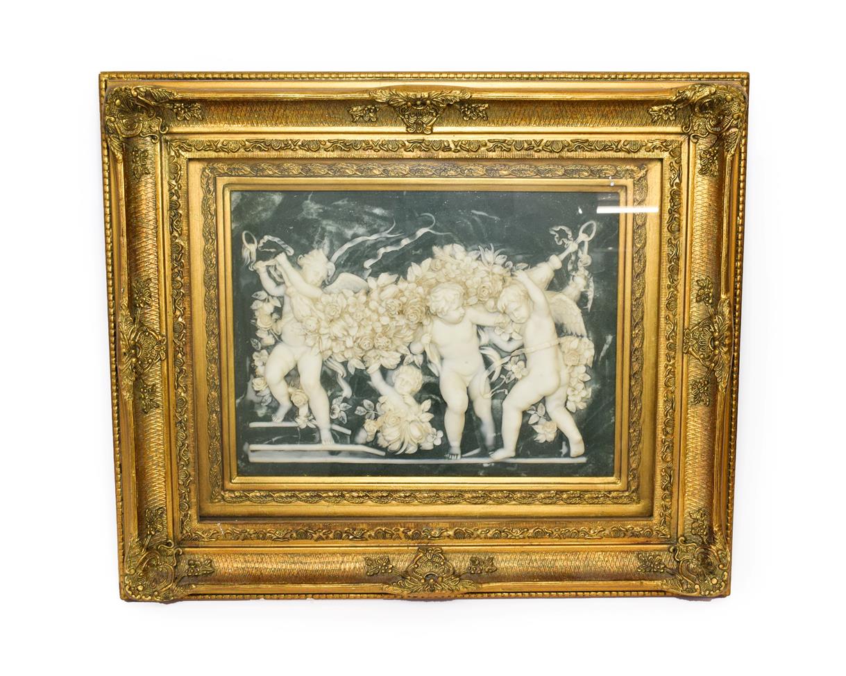 Lot 313 - After the Antique: A Marble Relief Panel, depicting putti holding swags of flowers and vine against