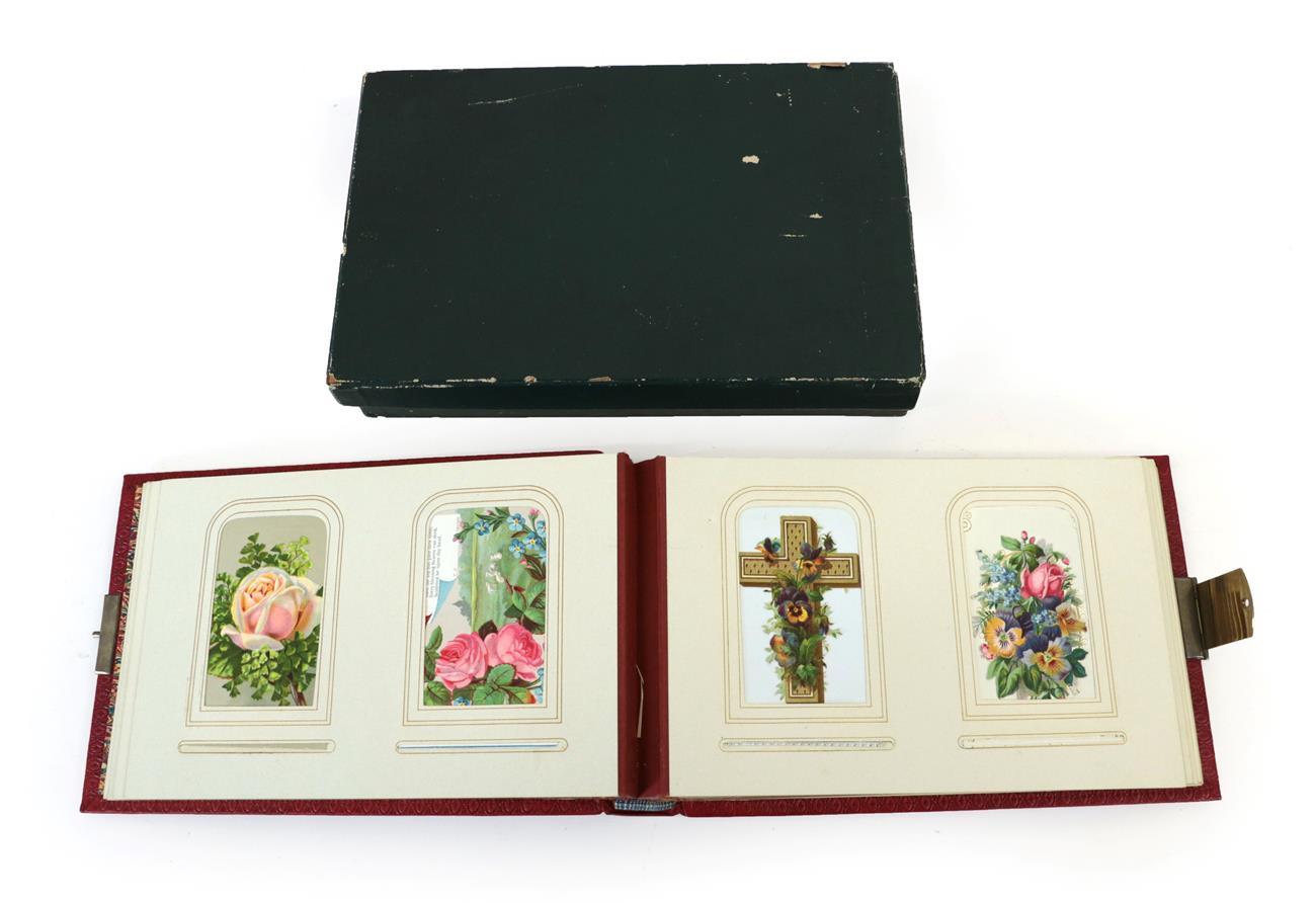 Lot 316 - A Victorian Scarlet Morocco Bound Album, containing a collection of cards, predominantly...