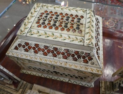 Lot 326 - A Russian Stained and Carved Walrus Ivory Casket, Archangel, early 19th century, of rectangular...