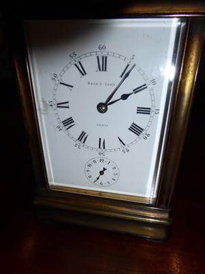 Lot 450 - A Brass Striking and Repeating Alarm Carriage Clock, signed Drocourt, retailed by Reid & Sons,...