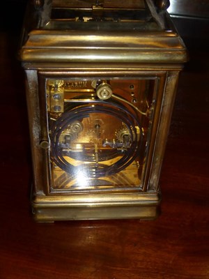 Lot 450 - A Brass Striking and Repeating Alarm Carriage Clock, signed Drocourt, retailed by Reid & Sons,...