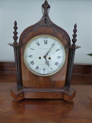 Lot 463 - A Gothic Revival Striking Table Clock, circa 1850, arched pediment, carved finials, side sound...