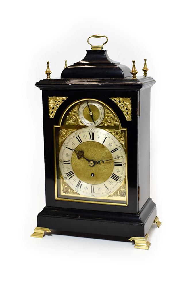 Lot 465 - An 18th Century Style Ebonised Table Timepiece, early 20th century, inverted bell top pediment with