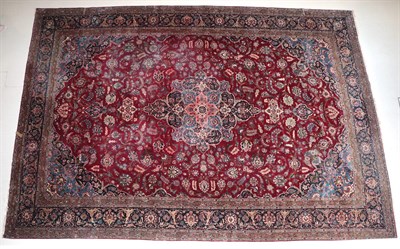 Lot 500 - Kashan Carpet Central Iran, circa 1940 The raspberry field of scrolling vines around a central pole