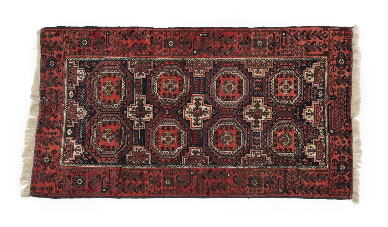 Lot 505 - Balouch Rug Persian/Afghan Frontier, circa 1900 The field with two columns of octagonal güls...