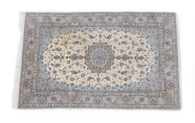 Lot 508 - Kashan Carpet Central Iran, circa 1970 The cream field of scrolling vines enclosed by spandrels and