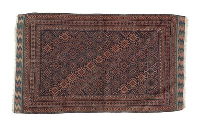 Lot 509 - Baluch Rug Irani/Afghan Frontier, early 20th century The midnight blue lattice field of hooked...