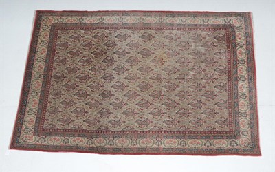 Lot 510 - Ghom Carpet Central Iran, circa 1950 The ivory oval lattice field of boteh enclosed by borders...