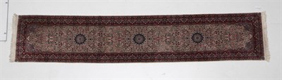 Lot 524 - Narrow Tabriz Runner  North west Iran, circa 1960 The ivory millefleur field with two flower...