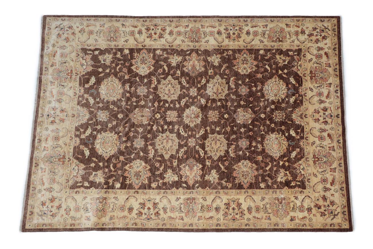 Lot 533 - Ziegler Design Rug Probably Afghanistan, modern The walnut brown field of angular vines and...