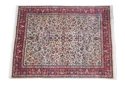 Lot 539 - Good Saroukh Carpet West Iran, circa 1960 The ivory field with scrolling floral vines and twin urns
