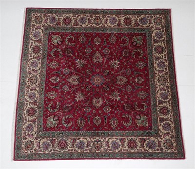 Lot 547 - Tabriz Carpet of unusual size North West Iran, 1950 The raspberry field of large palmettes and...